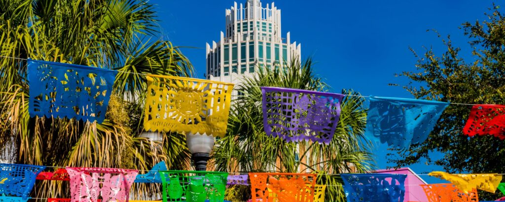 A vibrant picture of colored flags on strings in downtown San Antonio