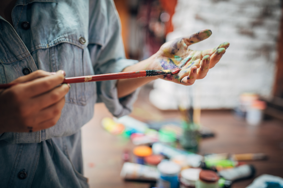 Lady with Paintbrush and Paint in hand